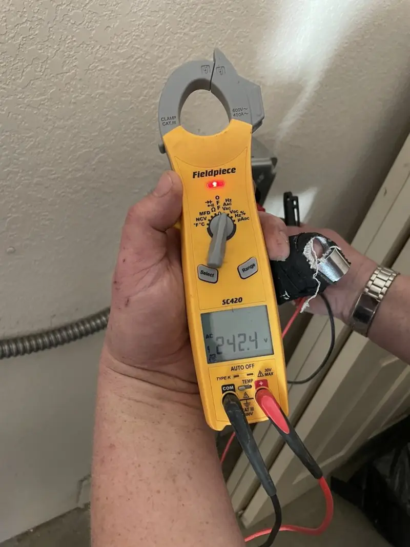 Voltage testing with clamp meter during Outlet Installation in Dupo